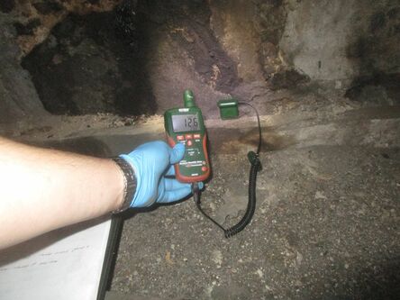Damp testing in an attic roof space