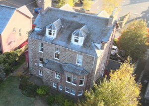 Drone image of rear of house showing roof
